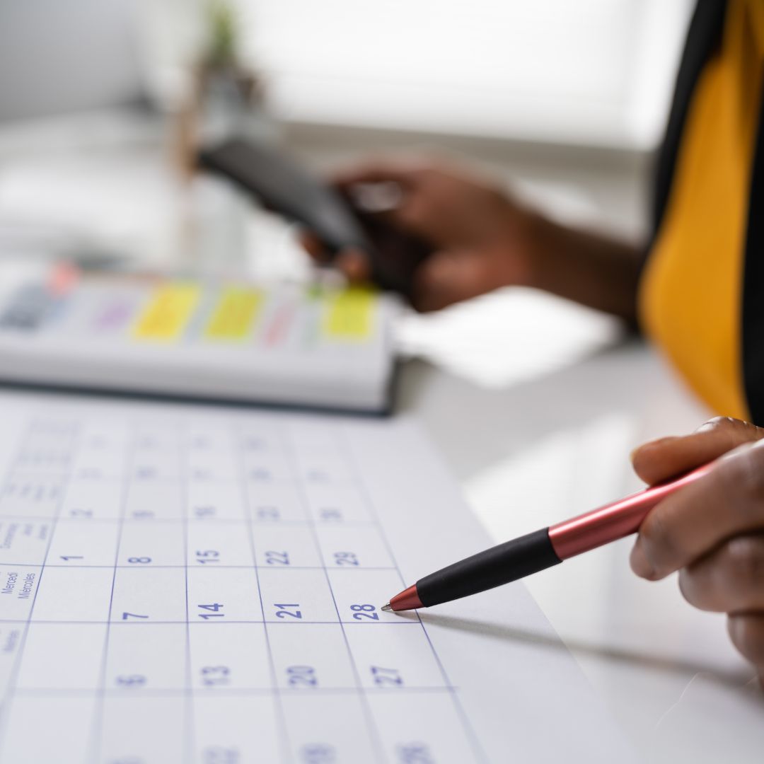 someone looking at a calendar