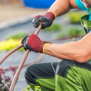 person working on landscaping irrigation