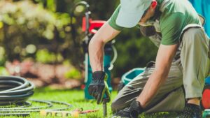 man installing irrigation