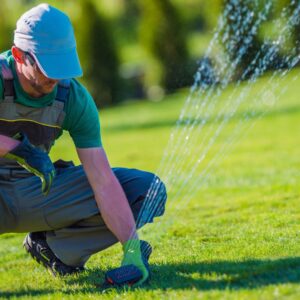 man installing sprinkler system