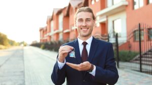 real estate sales agent with house keys