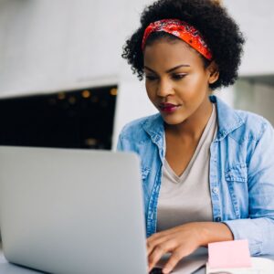 woman taking online course on laptop