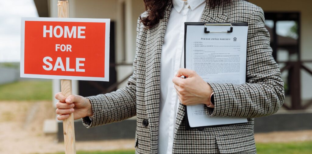 Realtor and a "For Sale" sign.