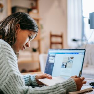Woman stuyding for real estate exam.